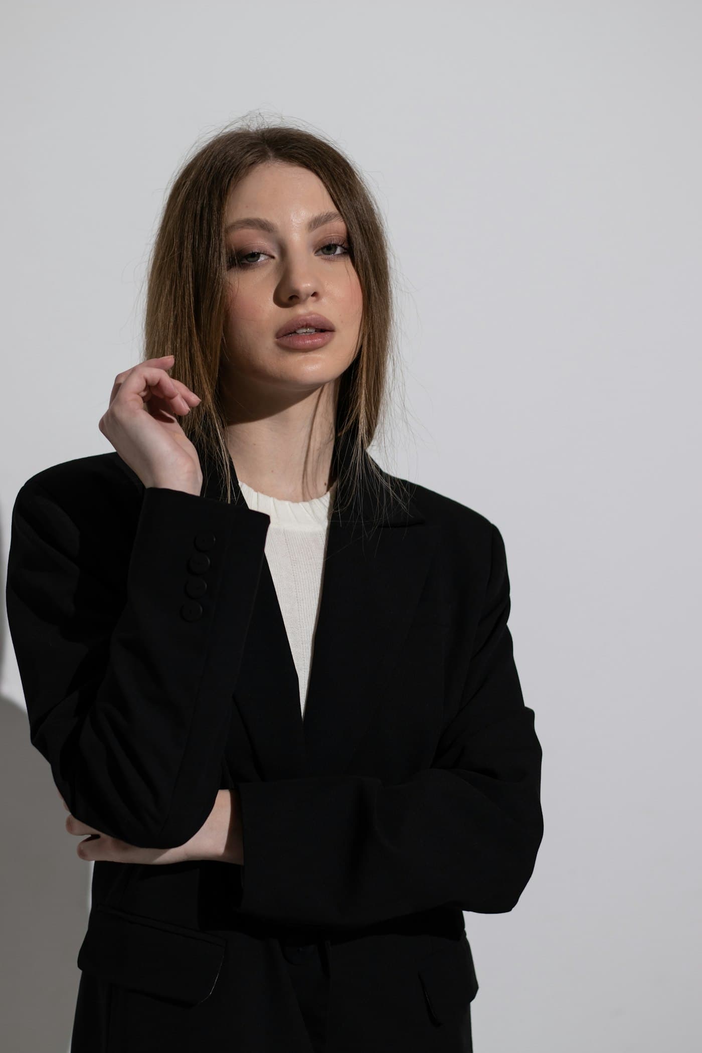 Model in black tailoring