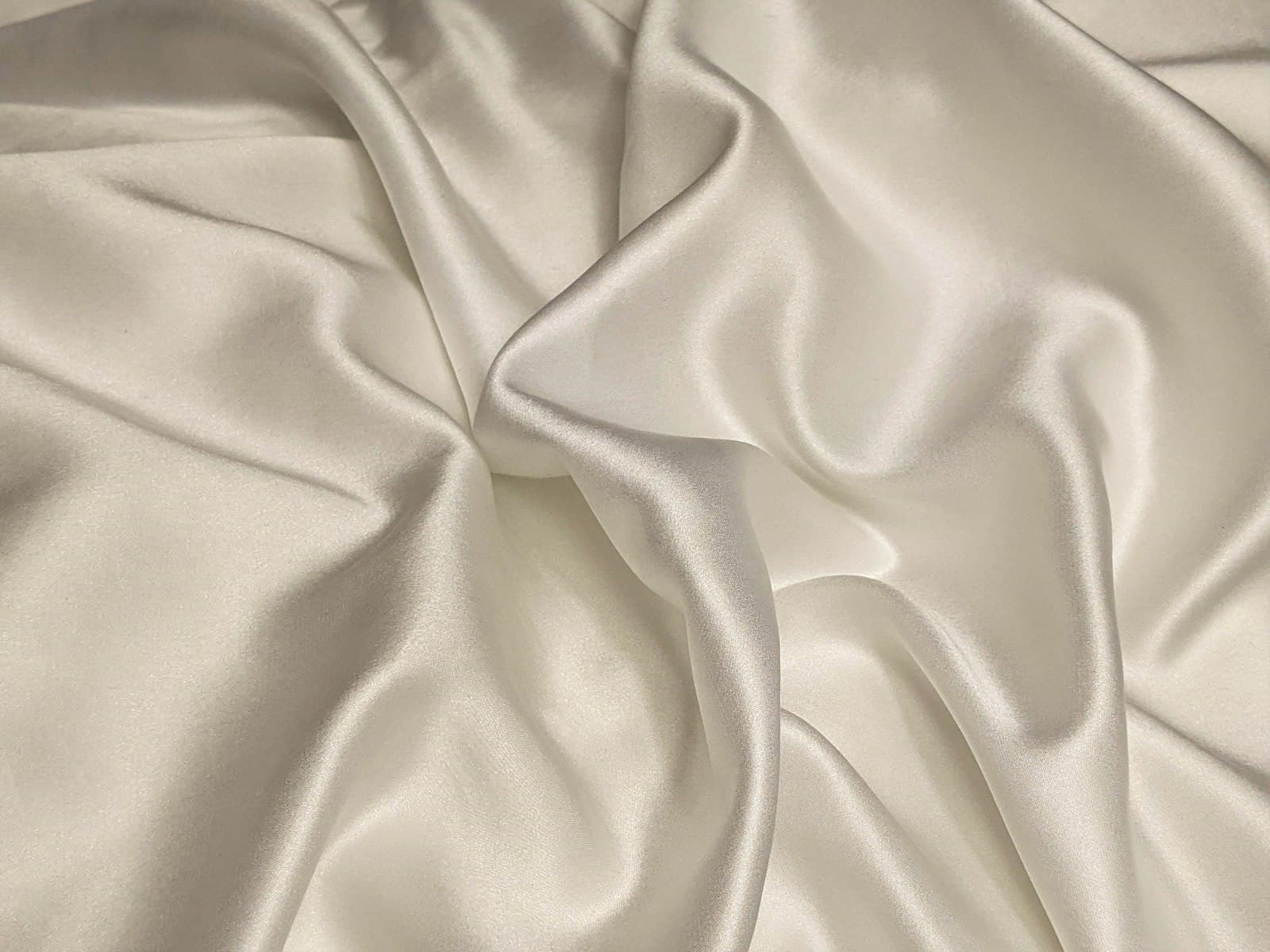 Ivory linen fabric moving in the light