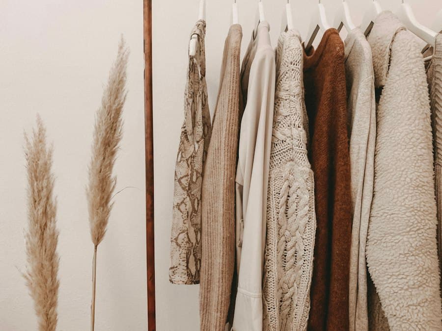 A rail of garments in brown, cream and ivory