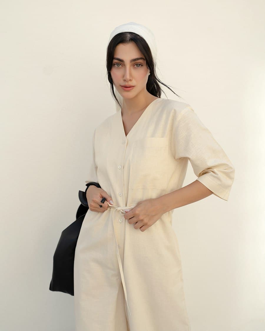 Model in an ivory dress in warm light