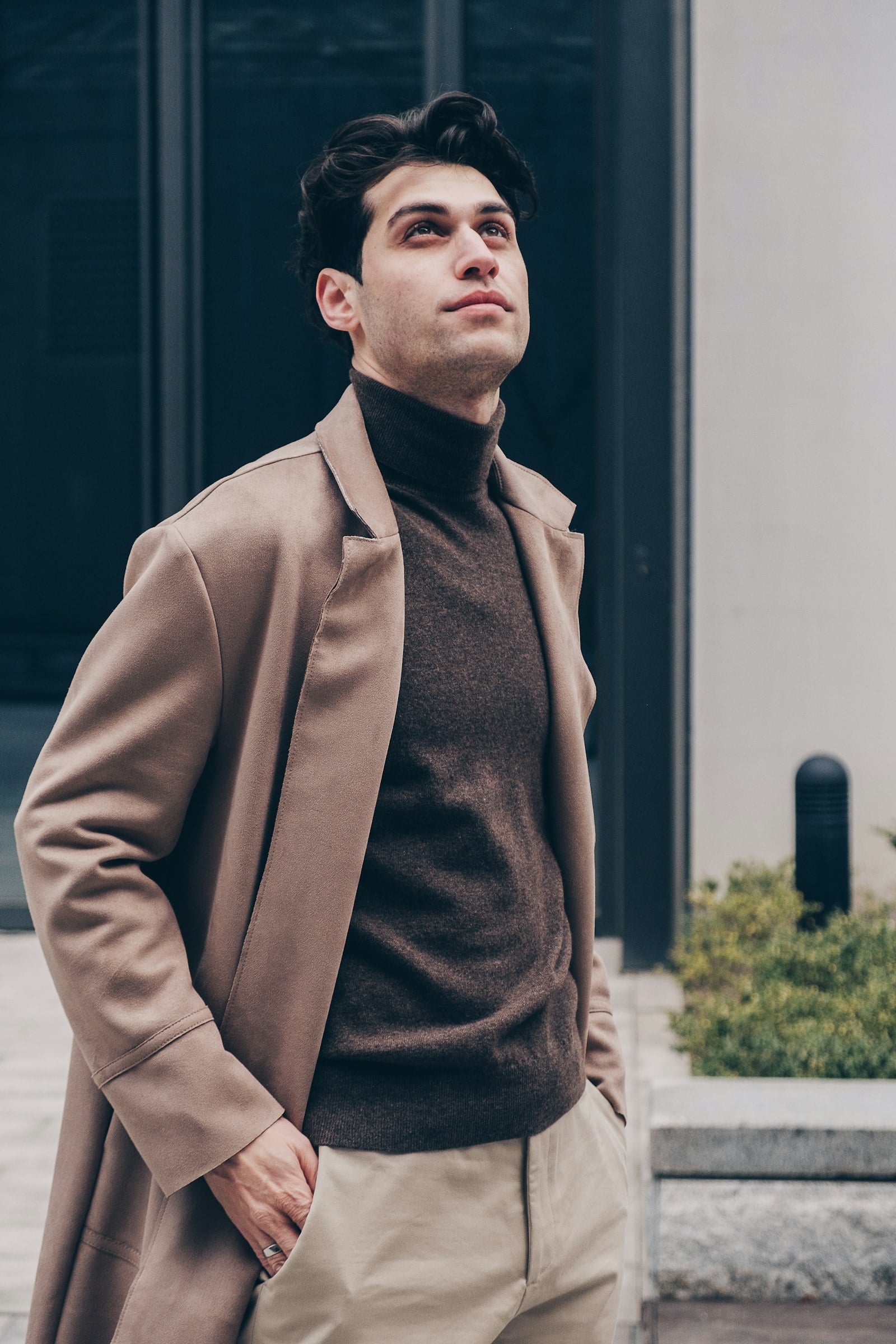 Male model in a brown wool blazer and sunglasses