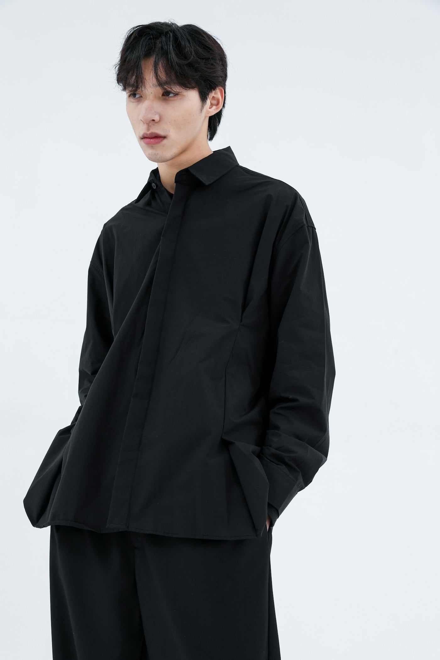 Male model in a black linen shirt